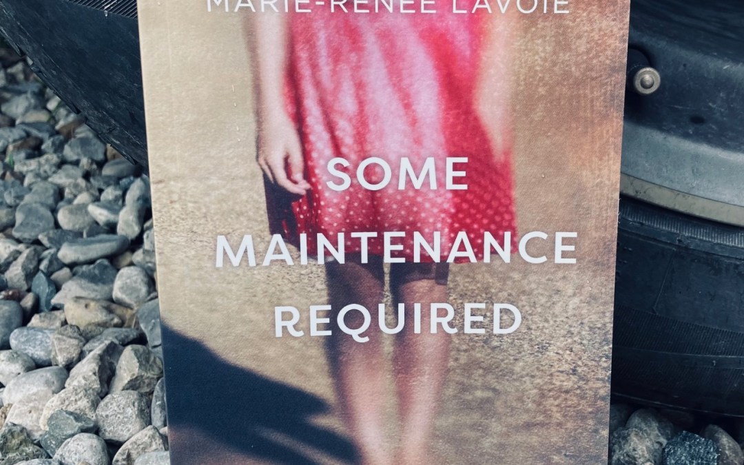 Some Maintenance Required by Marie-Renee Lavoie book pictured beside a car tire