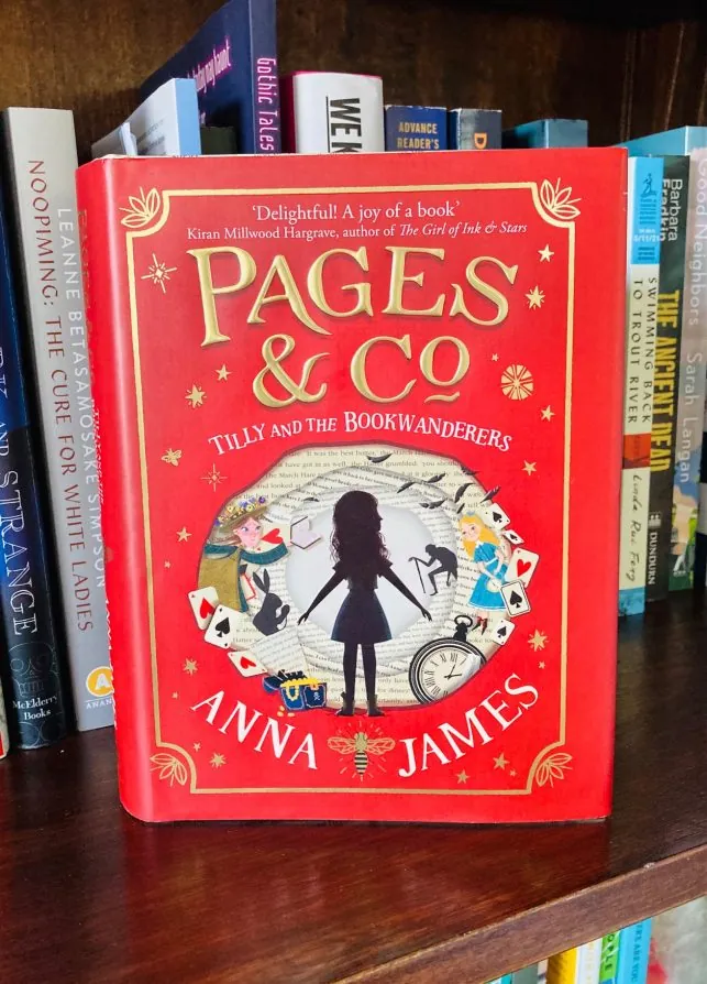 Pages and Co Tilly and the Bookwanderers by Anna James book on a bookshelf