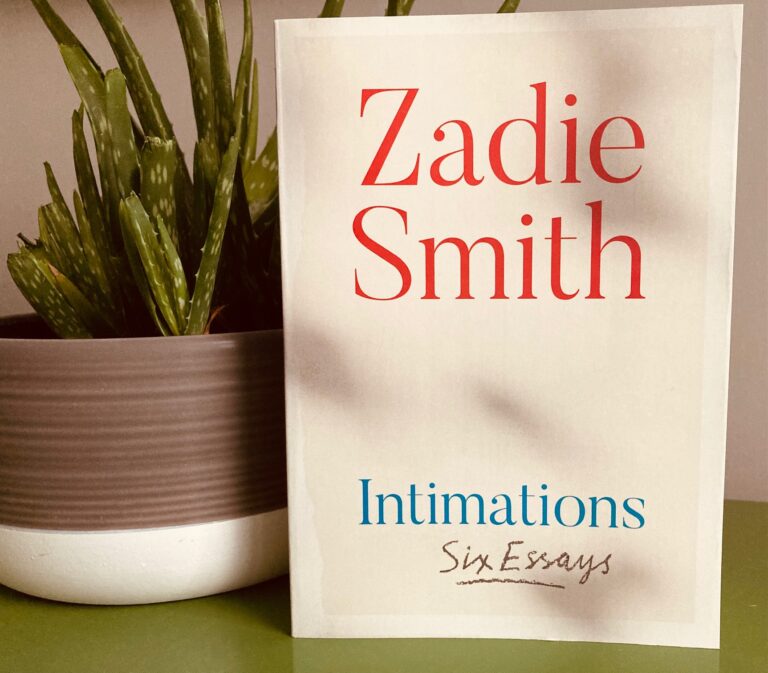 Intimations by Zadie Smith book pictured beside an aloe plant in a grey ceramic container