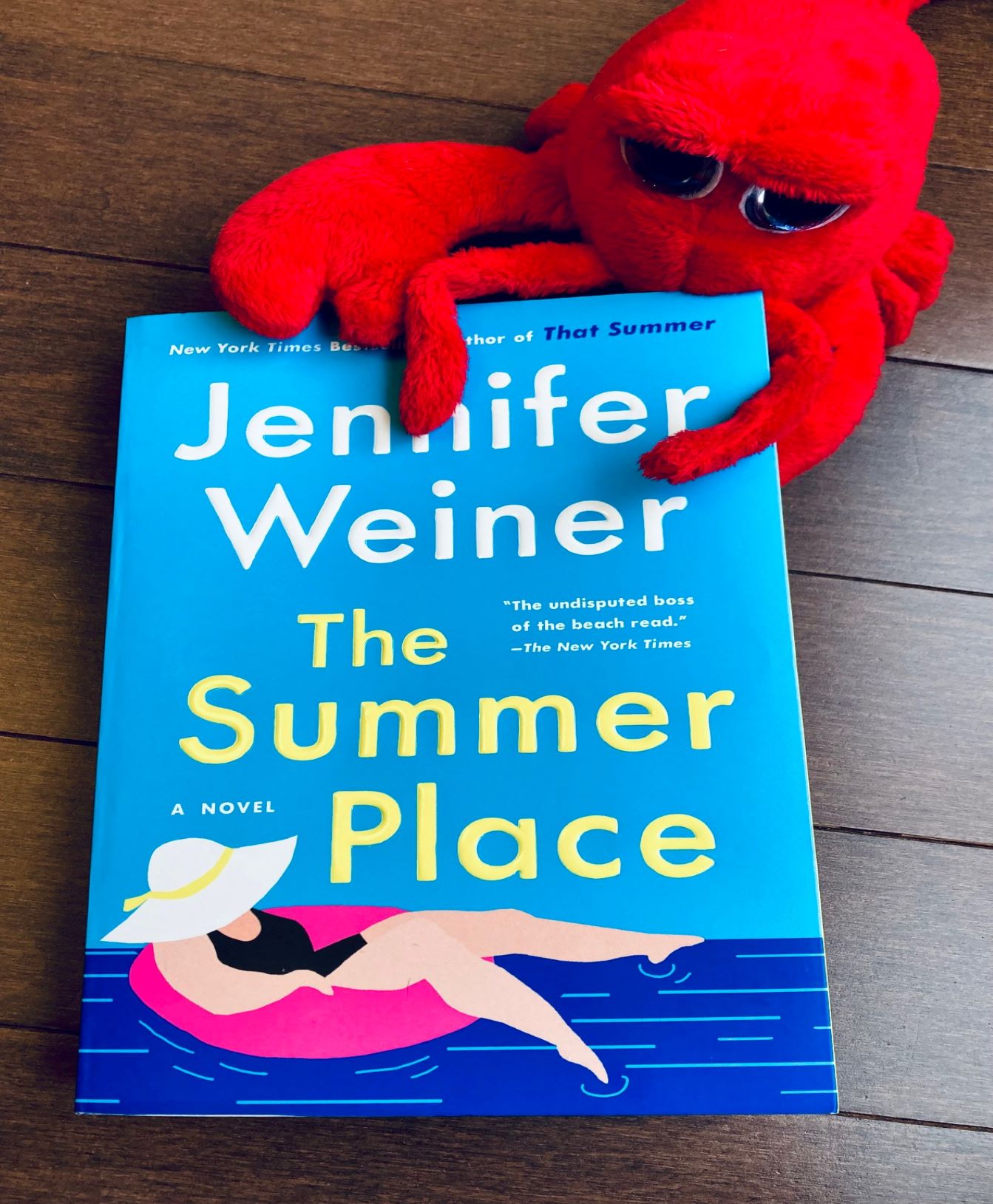 The Summer Place by Jennifer Weiner book with a stuffed crab