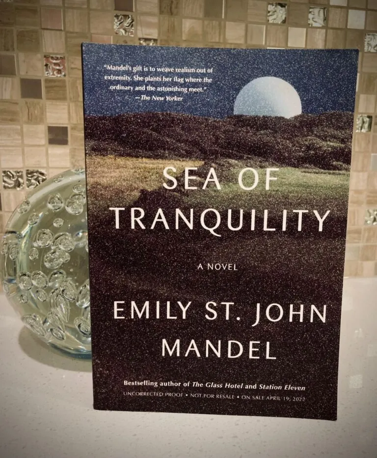 Sea of Tranquility by Emily St. John Mandel book with a glass orb behind it