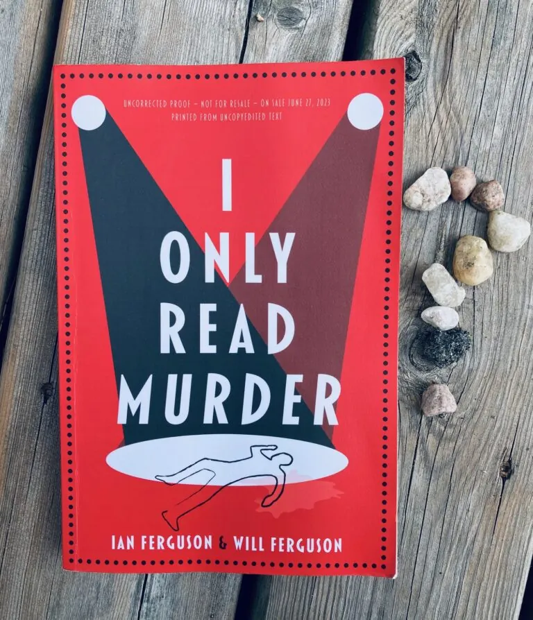 I Only Read Murder by Ian Ferguson & Will Ferguson book pictured on a wooden plank