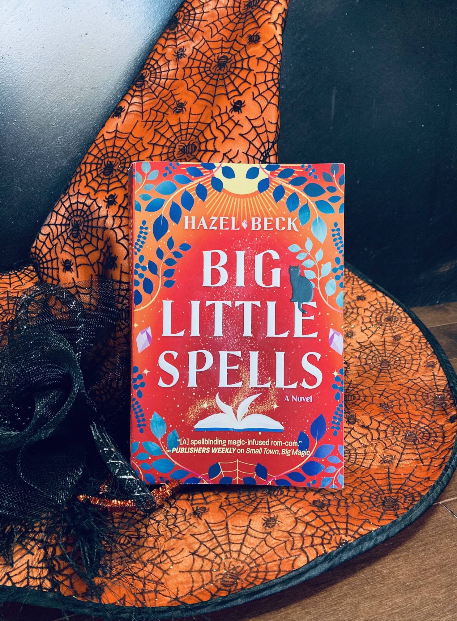 Big Little Spells by Hazel Beck book pictured on a witch hat