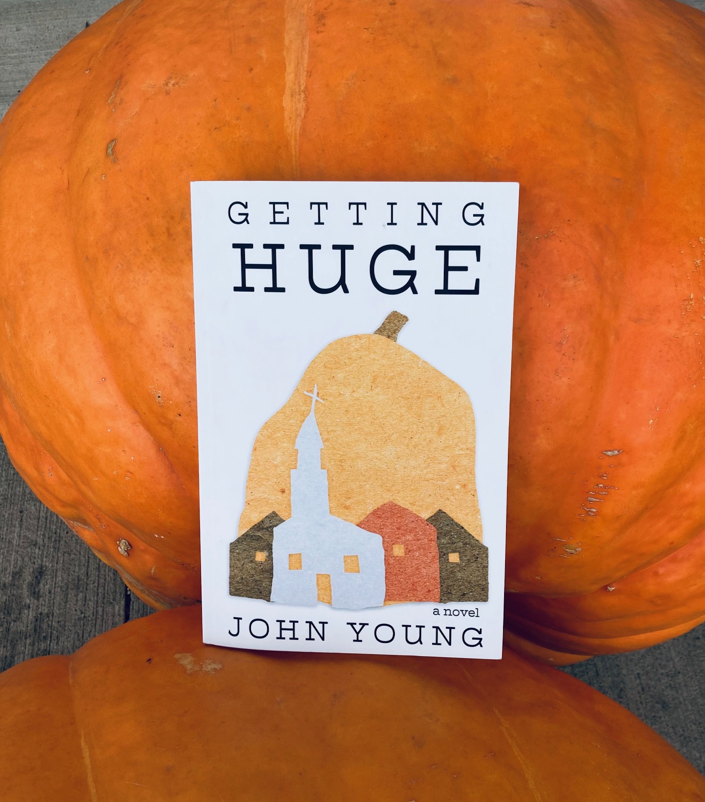 Getting Huge by John Young book pictured with large pumpkins
